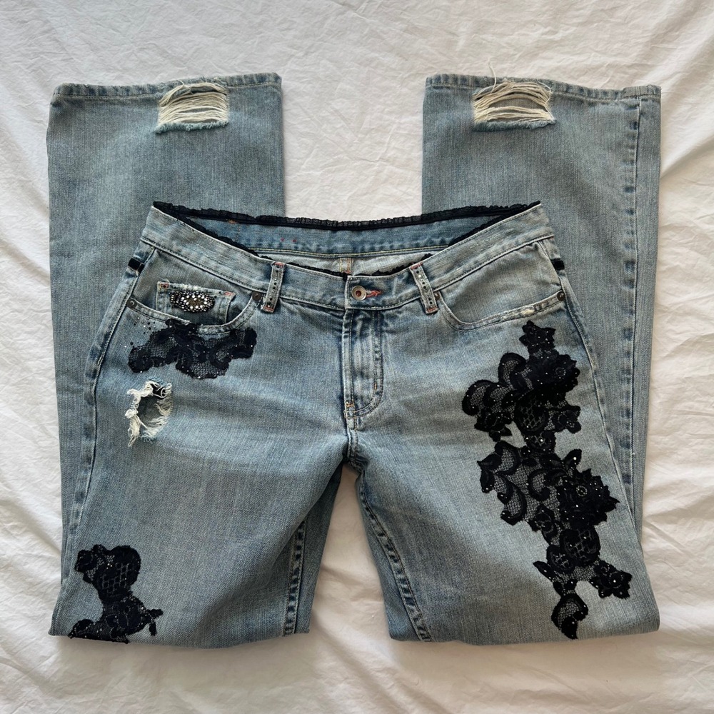 vintage low rise bootcut jeans with black lace patches